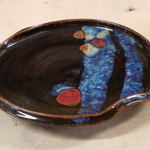Old Black Magic Plate with Blue and Red accents